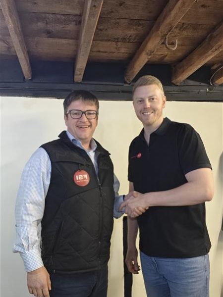 New FSI UK shareholder Lee Hatton with FSI Stump Cutters director Kim Schmidt - shaking on the deal